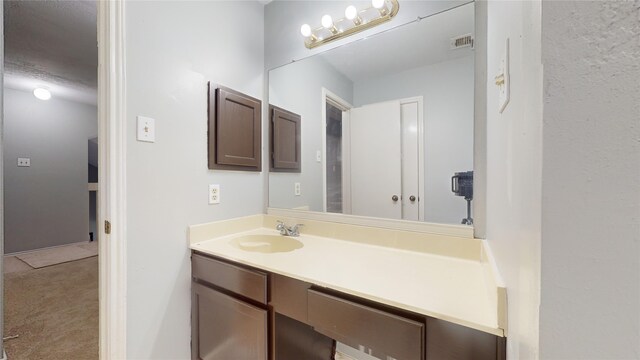 bathroom featuring visible vents and vanity