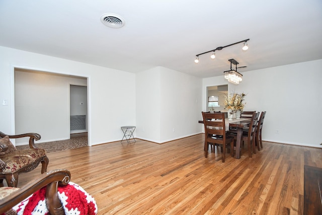 dining space featuring light hardwood / wood-style floors