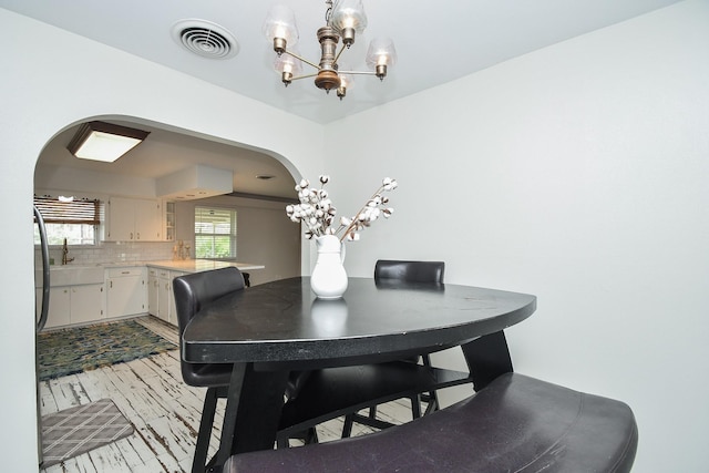 dining room with a notable chandelier