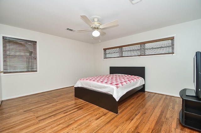 bedroom featuring wood-type flooring and ceiling fan