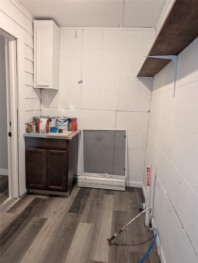 laundry room with dark hardwood / wood-style flooring