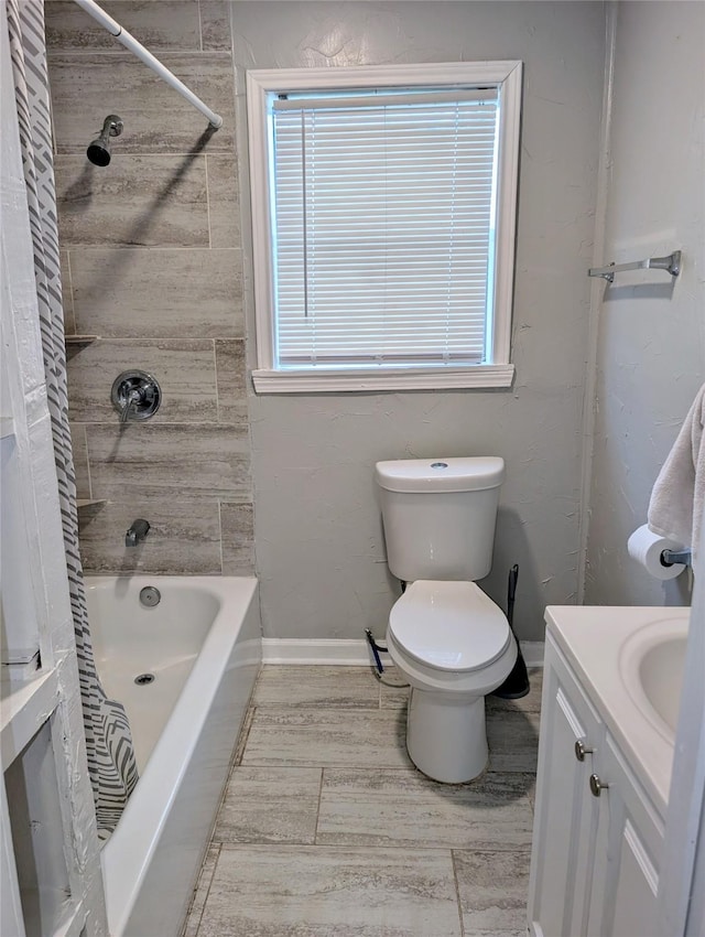 full bathroom with tile patterned floors, vanity, toilet, and shower / bath combo