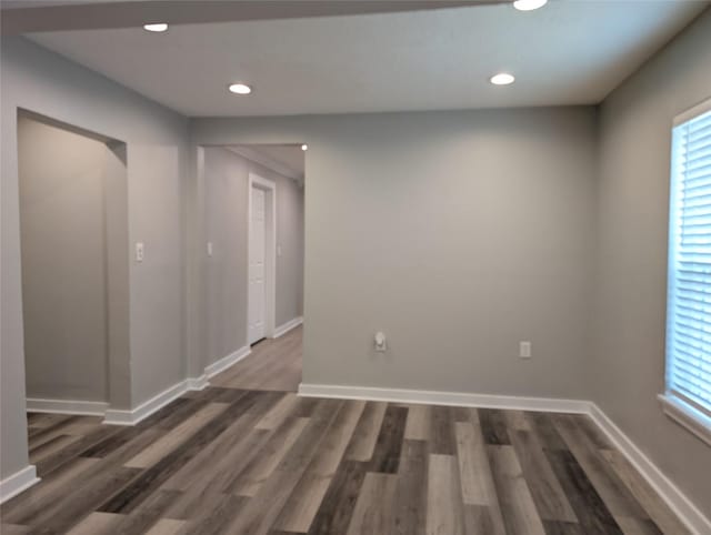 spare room featuring dark hardwood / wood-style floors