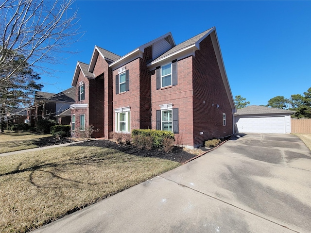 view of side of home with a yard