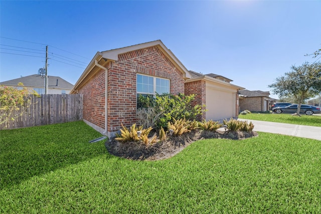 view of front of property featuring a garage and a front yard