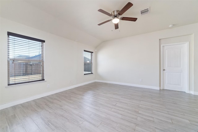 unfurnished room with vaulted ceiling and ceiling fan