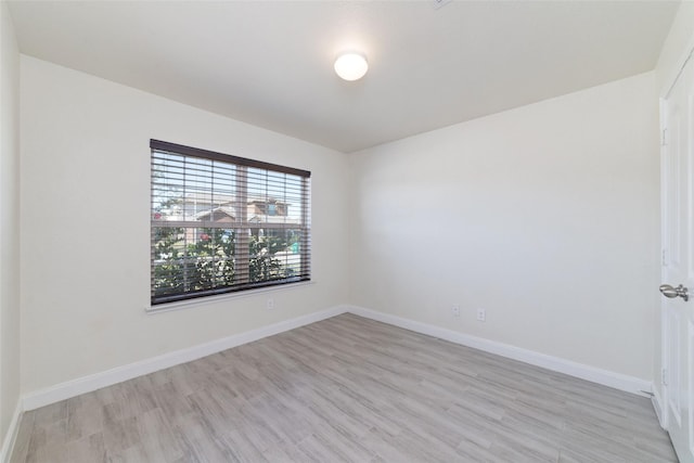 spare room featuring light wood-type flooring