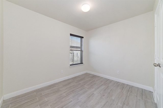 unfurnished room with light hardwood / wood-style floors