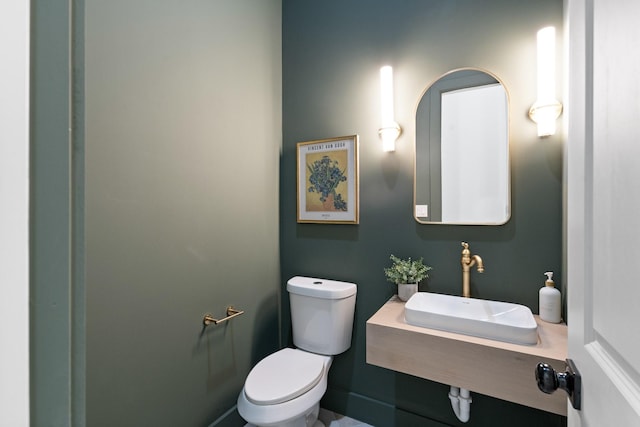 bathroom featuring sink and toilet