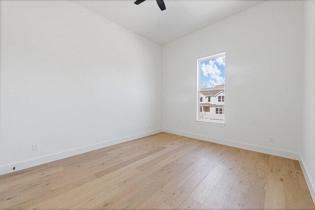 unfurnished room featuring ceiling fan, lofted ceiling, and light hardwood / wood-style floors