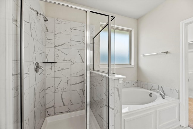 bathroom with separate shower and tub