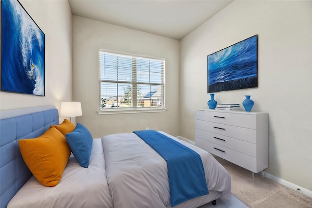 bedroom featuring light carpet