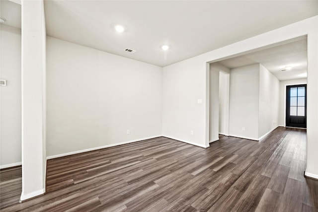 spare room featuring dark hardwood / wood-style floors