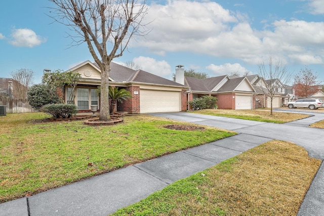 single story home with a garage, a front yard, and central air condition unit