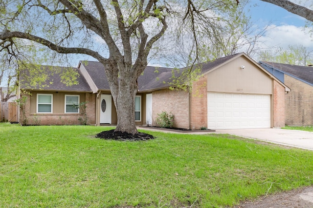 single story home featuring an attached garage, a shingled roof, concrete driveway, a front lawn, and brick siding