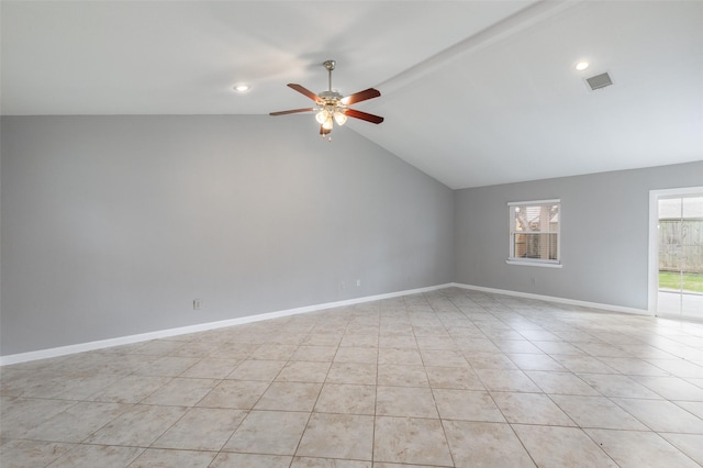 unfurnished room featuring visible vents, lofted ceiling, light tile patterned floors, baseboards, and ceiling fan