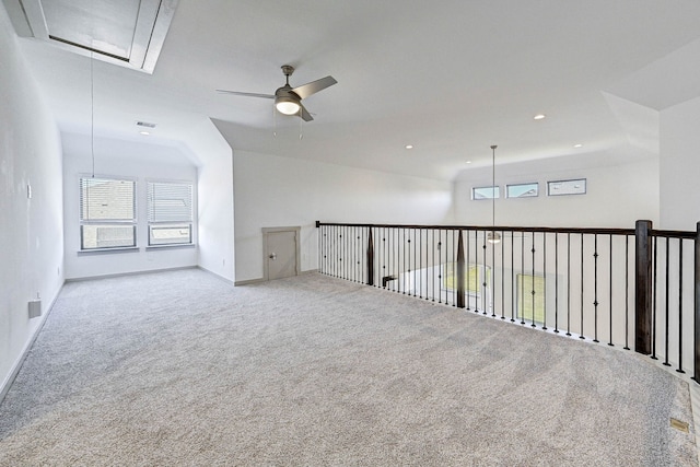 carpeted empty room featuring ceiling fan