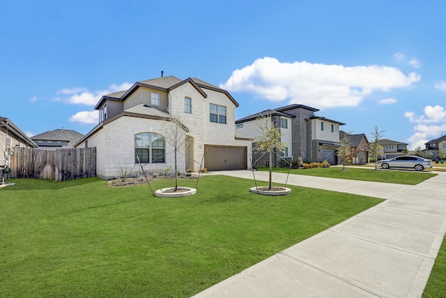 view of front facade featuring a garage and a front yard