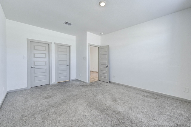 unfurnished bedroom with carpet