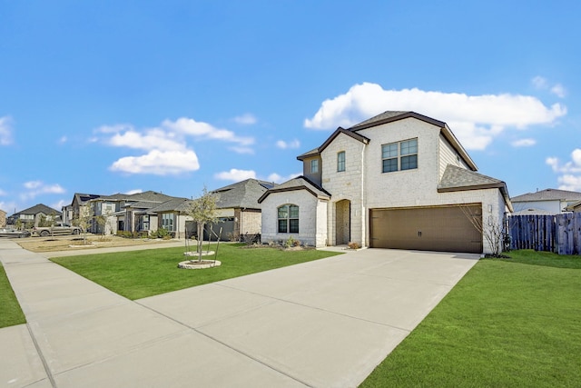 view of front of house with a garage and a front yard