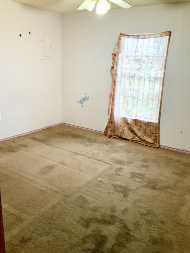 empty room with carpet floors and ceiling fan