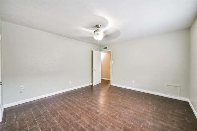 unfurnished room featuring dark hardwood / wood-style flooring and ceiling fan