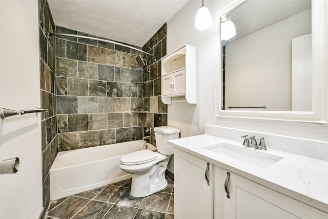 full bathroom with tiled shower / bath, vanity, and toilet