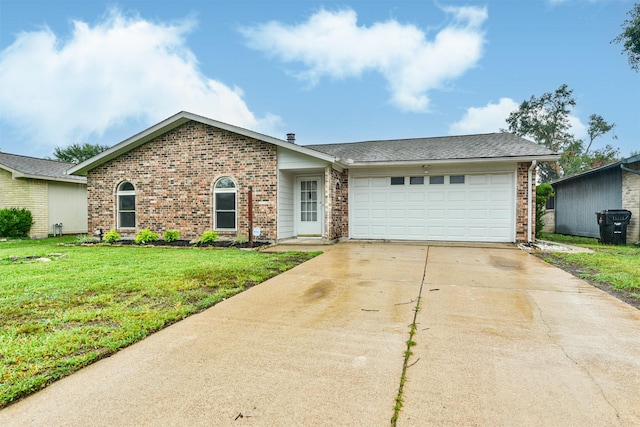 ranch-style house with a garage and a front lawn