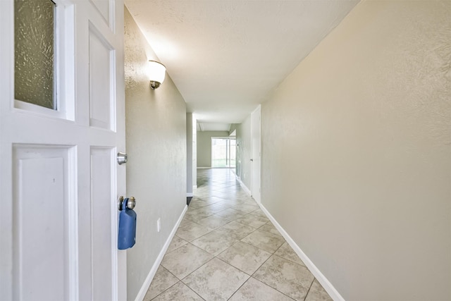 corridor featuring light tile patterned flooring