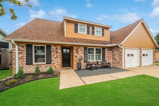 view of front facade with a garage and a front yard