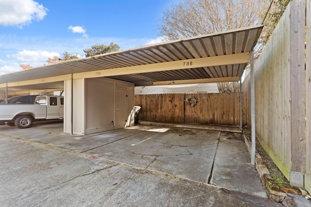 view of vehicle parking with a carport