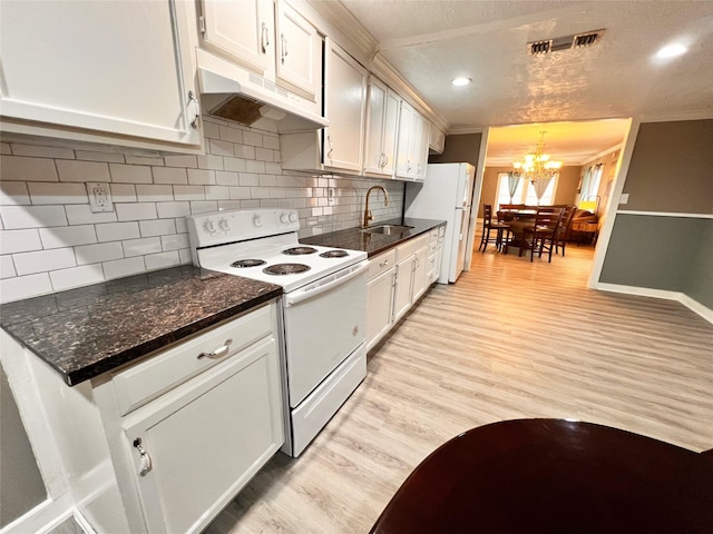 kitchen with sink, white appliances, light hardwood / wood-style flooring, and white cabinets