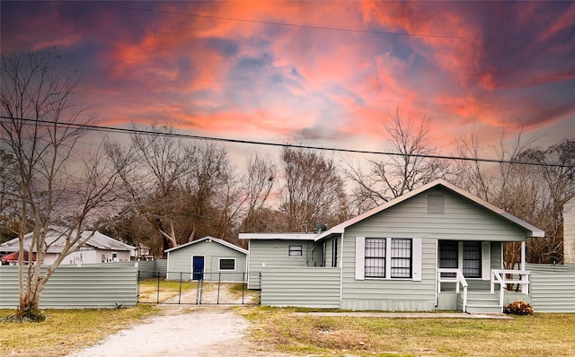 view of front of home with a yard and a porch