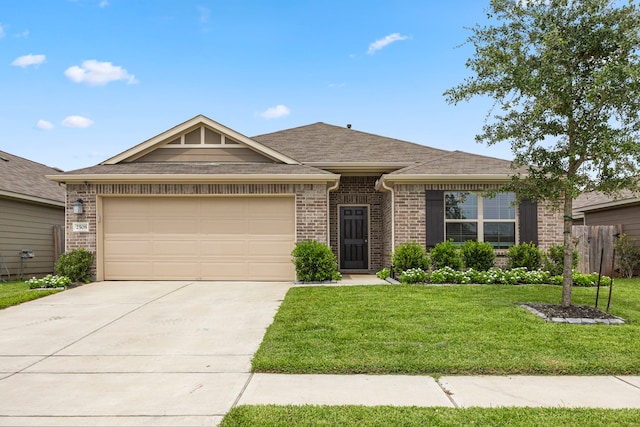 ranch-style home featuring a garage and a front yard