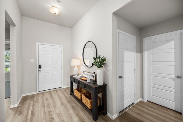 foyer entrance with light hardwood / wood-style flooring