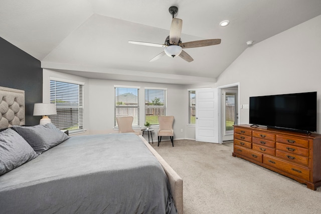 carpeted bedroom featuring ceiling fan and lofted ceiling