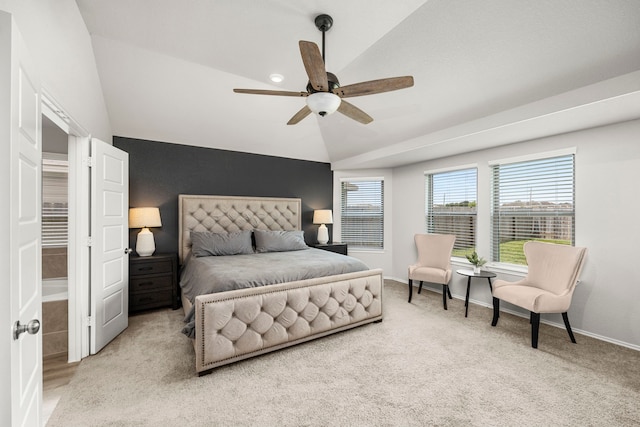 bedroom featuring vaulted ceiling, light carpet, and ceiling fan