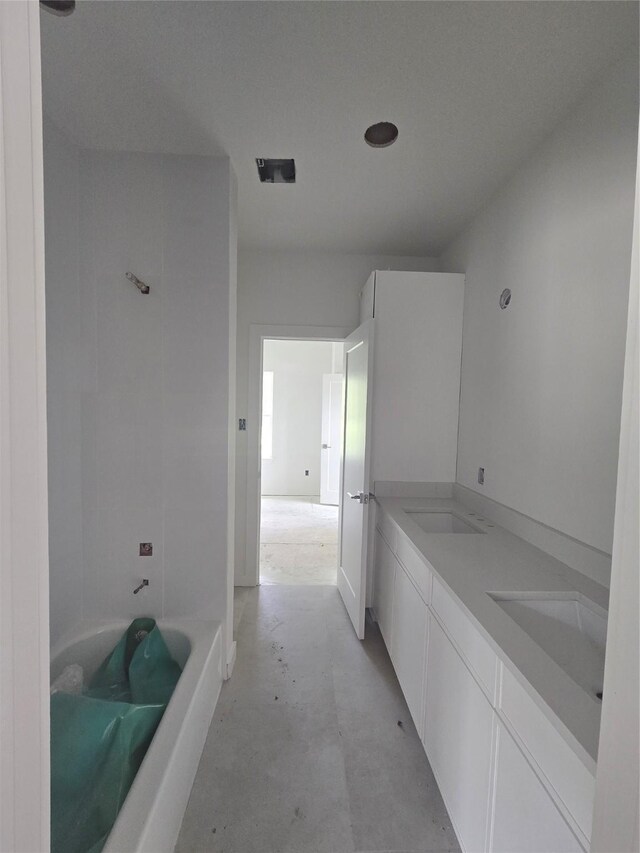 9630 Burden St, Houston, TX 77093 - bathroom with concrete flooring and double vanity