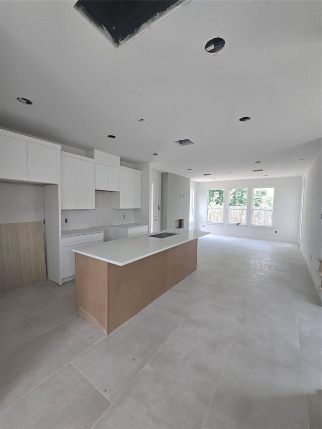 9630 Burden St, Houston, TX 77093 - kitchen featuring modern cabinets, white cabinetry, a large island, and open floor plan
