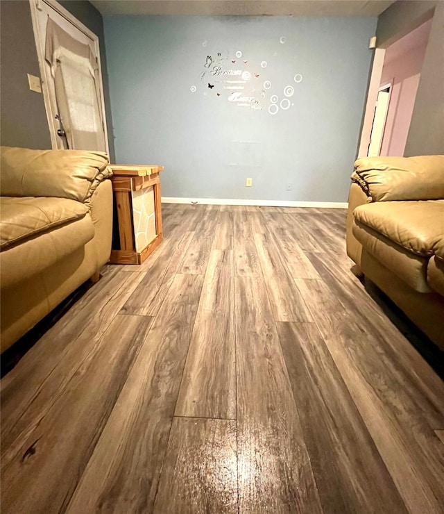 unfurnished living room featuring hardwood / wood-style flooring