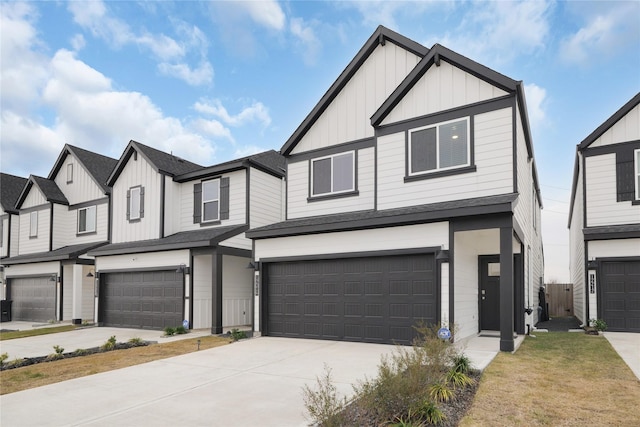 view of front of property featuring board and batten siding, concrete driveway, a shingled roof, and an attached garage