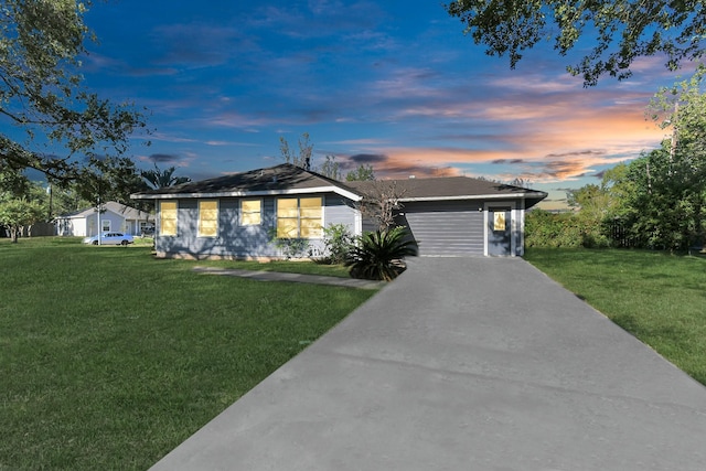 ranch-style house with a carport and a yard