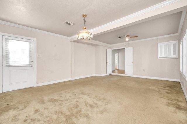 empty room featuring crown molding, ceiling fan, and carpet flooring