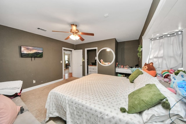 bedroom featuring light carpet and ceiling fan