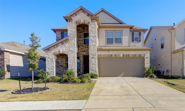 view of front of property featuring a garage, central air condition unit, and a front lawn