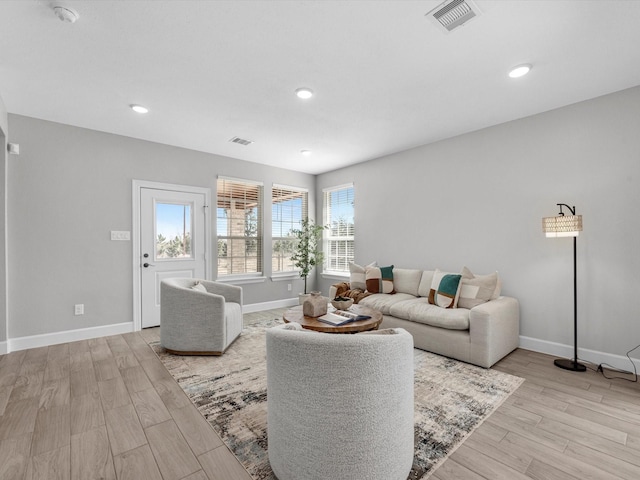 living room with light hardwood / wood-style floors