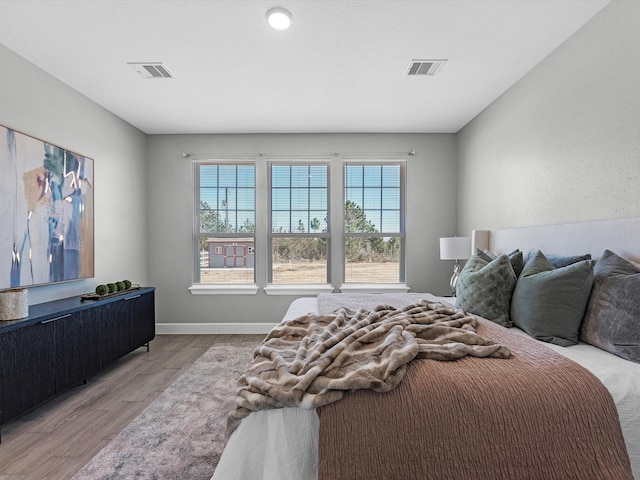 bedroom with light wood-type flooring