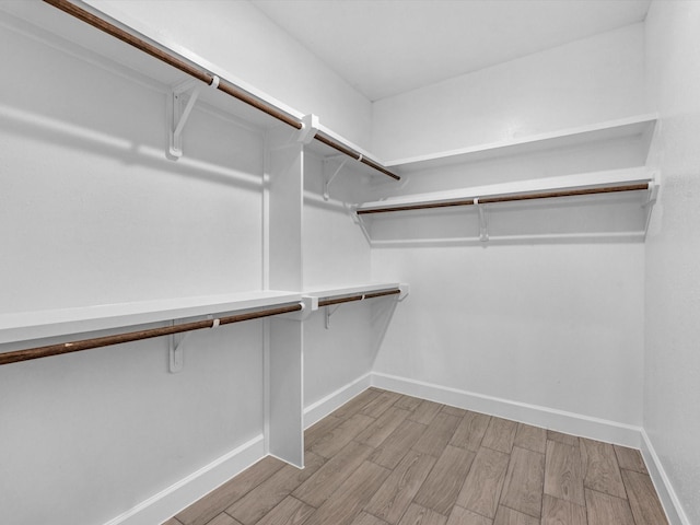 walk in closet featuring light wood-type flooring