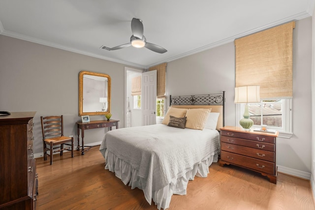 bedroom featuring crown molding, hardwood / wood-style flooring, and ceiling fan