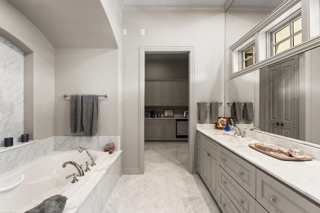 bathroom featuring vanity, tiled tub, and ornamental molding